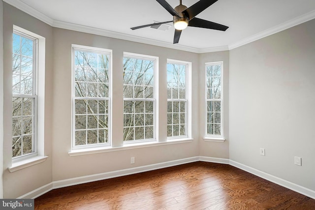 interior space with dark wood-type flooring, crown molding, and ceiling fan