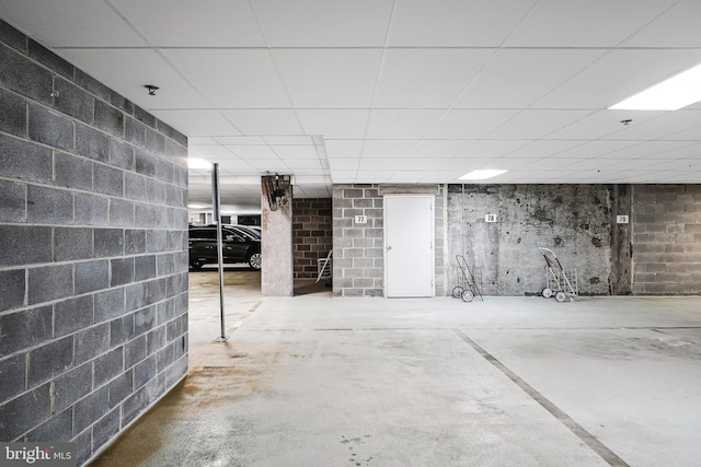 basement featuring a paneled ceiling