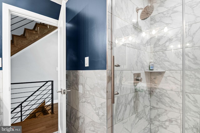 bathroom with a shower with shower door