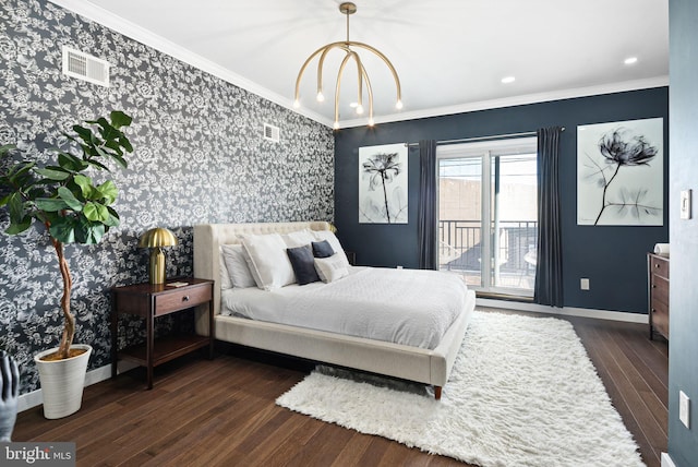 bedroom featuring ornamental molding, dark hardwood / wood-style floors, a chandelier, and access to outside