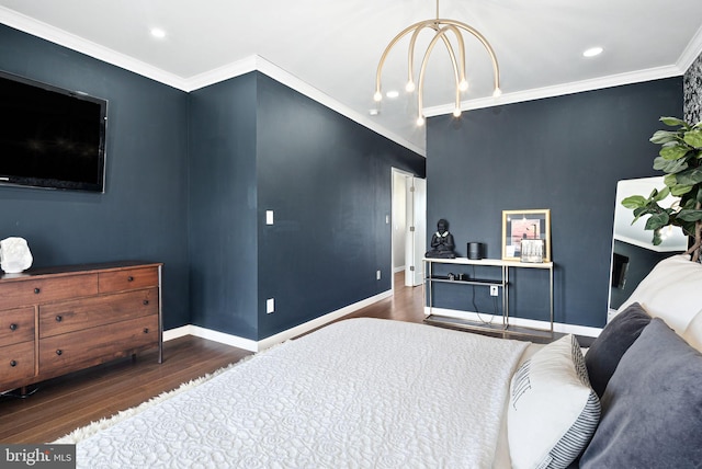 bedroom featuring dark wood-type flooring, crown molding, and a chandelier