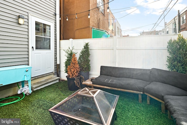 view of patio / terrace with a fire pit