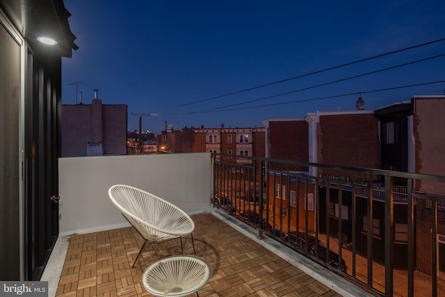 view of patio featuring a balcony