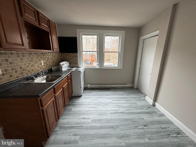 kitchen featuring a baseboard radiator, sink, decorative backsplash, light wood-type flooring, and electric stove