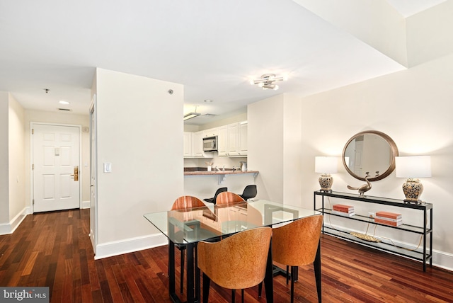 dining room featuring dark wood-type flooring