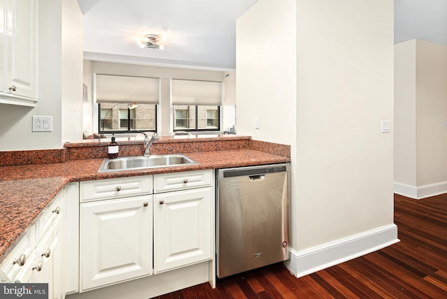 kitchen featuring white cabinetry, stainless steel dishwasher, dark hardwood / wood-style flooring, and sink