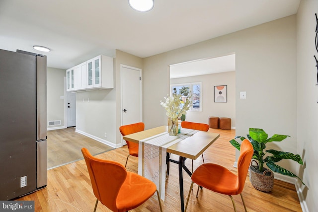 dining space featuring light hardwood / wood-style floors