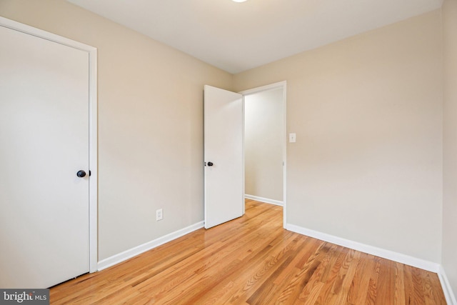 unfurnished bedroom with light wood-type flooring