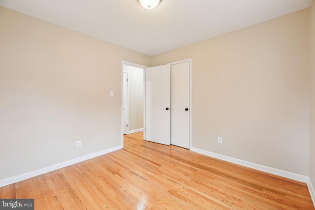 spare room with light hardwood / wood-style floors