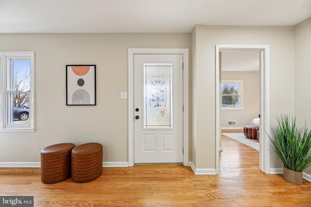 foyer with light hardwood / wood-style floors