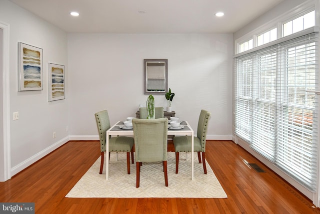 dining space featuring recessed lighting, wood finished floors, and visible vents