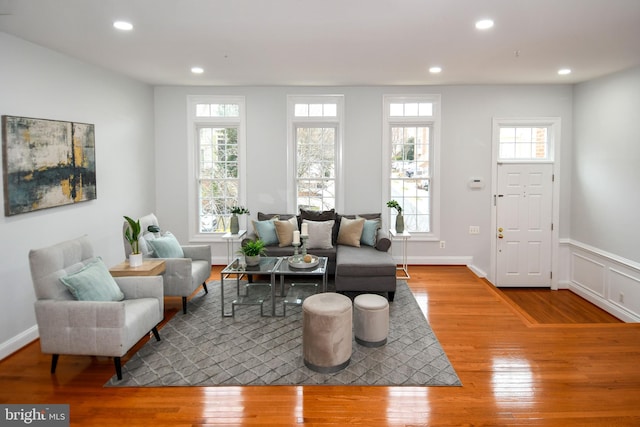 living area featuring plenty of natural light, recessed lighting, and hardwood / wood-style floors