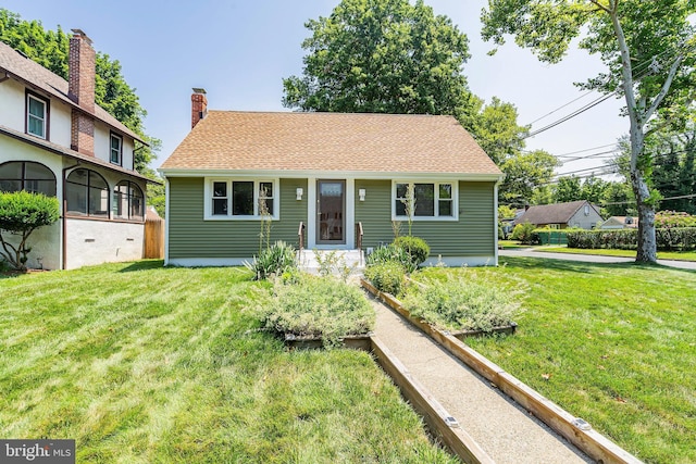 view of front of home with a front lawn