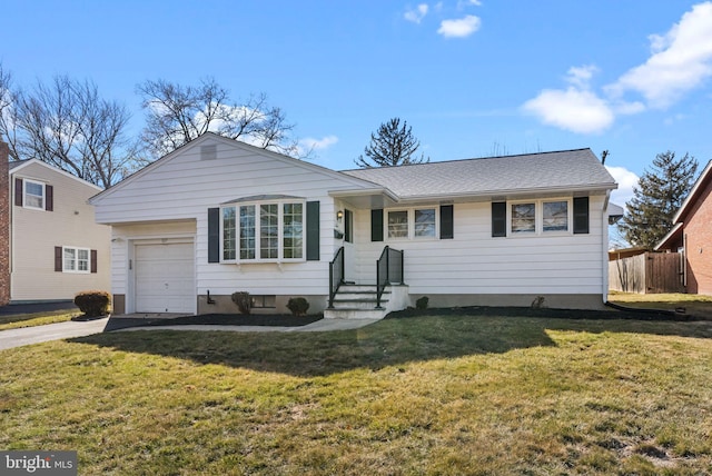 ranch-style house featuring a front lawn and a garage