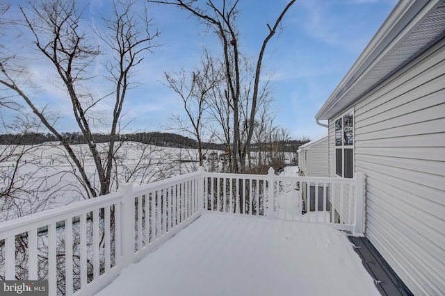 view of snow covered deck