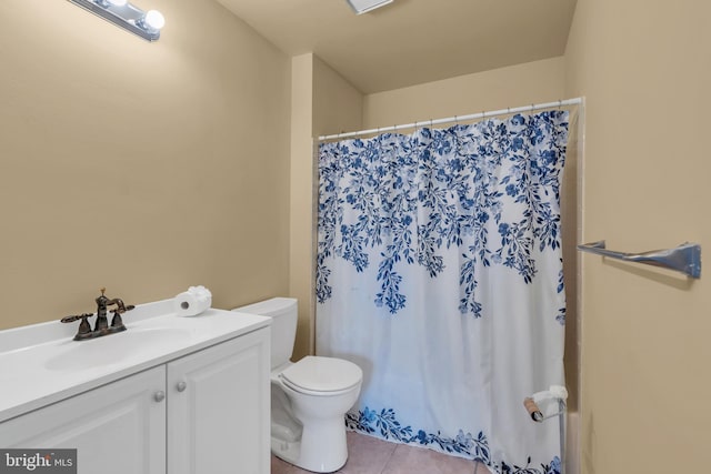 full bath featuring toilet, tile patterned flooring, and vanity