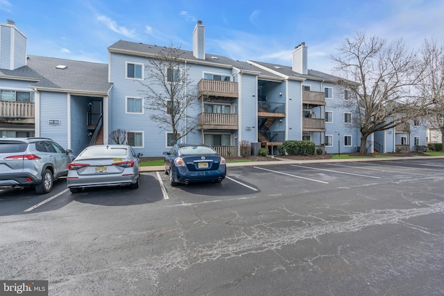 view of property with uncovered parking