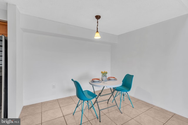 dining room featuring light tile patterned flooring