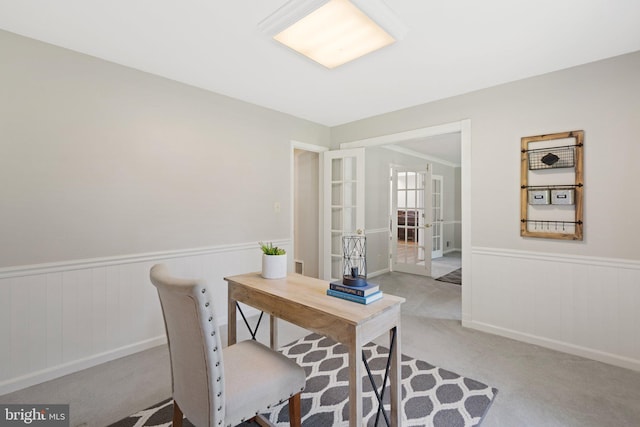 office area featuring french doors, wainscoting, visible vents, and carpet flooring