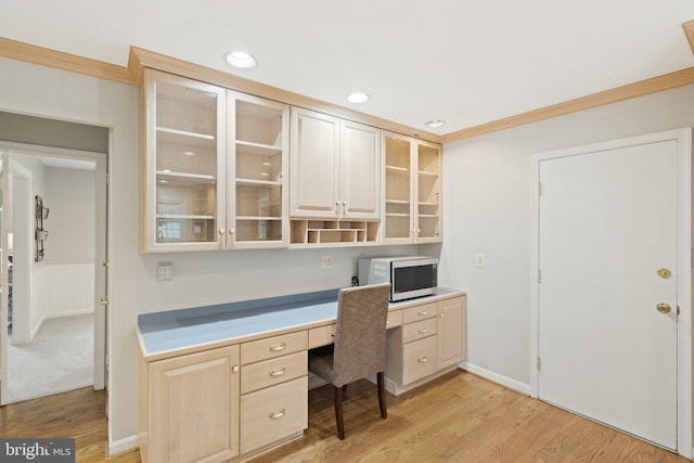 office featuring recessed lighting, crown molding, light wood-style flooring, and baseboards