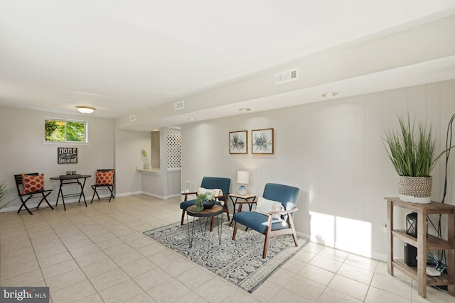 sitting room featuring visible vents, baseboards, and light tile patterned flooring