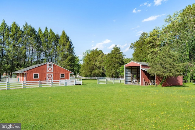 view of yard with an outbuilding, an exterior structure, and an outdoor structure