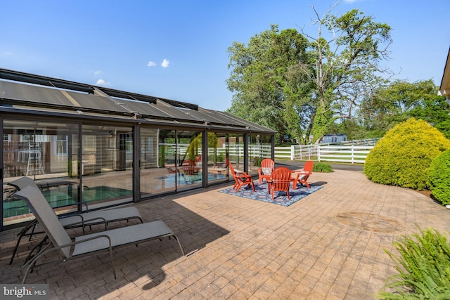 view of patio featuring fence and an outdoor pool