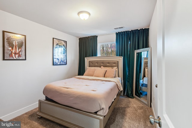 carpeted bedroom with visible vents and baseboards