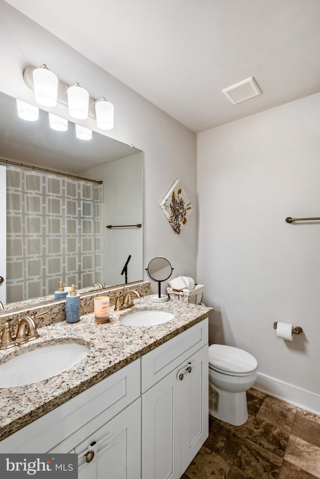 full bath featuring baseboards, visible vents, a sink, and toilet