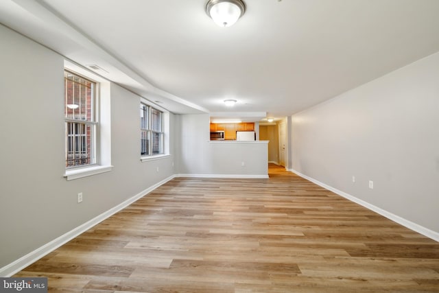 unfurnished living room with light hardwood / wood-style floors