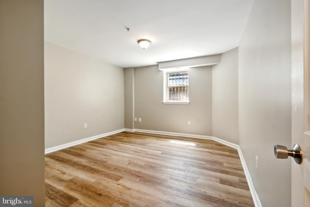 unfurnished room with light hardwood / wood-style flooring