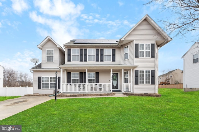 11198 Sewickley St, Waldorf, MD 20601 - view of front of home with roof mounted solar panels, fence, a porch, and a front yard