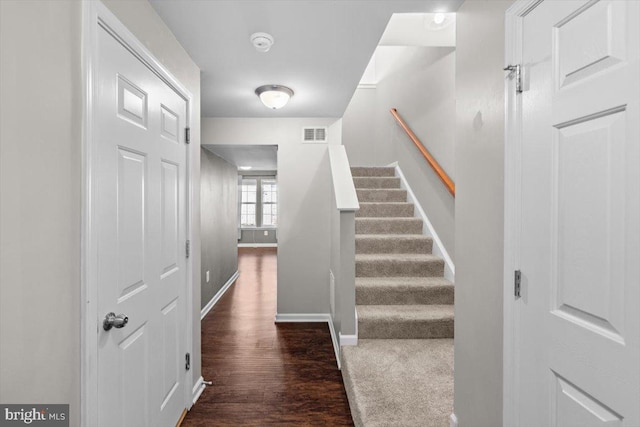 stairs with wood-type flooring