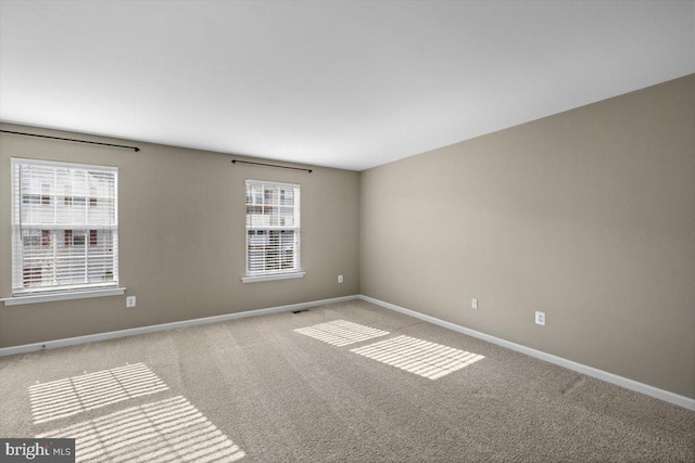 spare room with light carpet