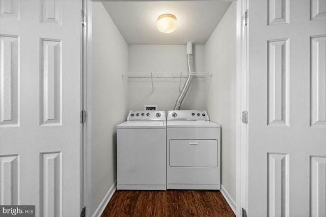 laundry room featuring separate washer and dryer and dark hardwood / wood-style floors