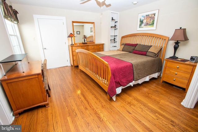 bedroom featuring a ceiling fan and light wood-style floors