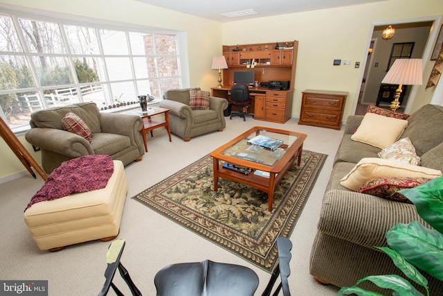 living room with carpet and visible vents