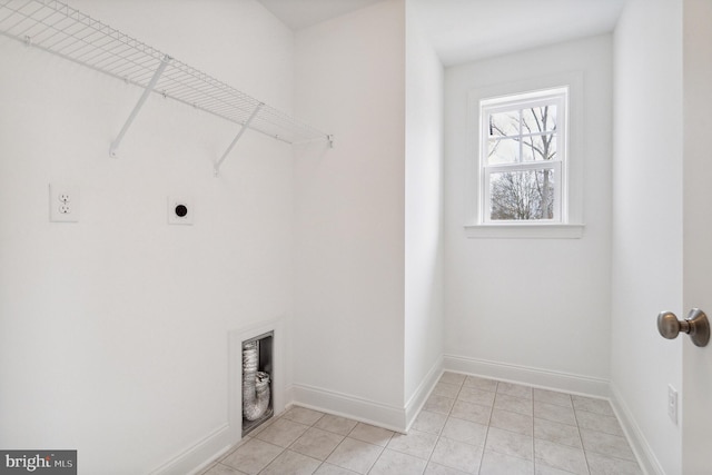 clothes washing area with light tile patterned flooring and electric dryer hookup