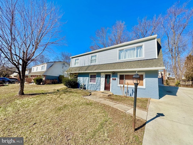 view of front of home with a front yard