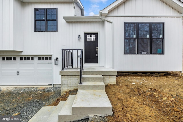 entrance to property featuring an attached garage