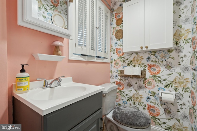 bathroom with vanity and toilet