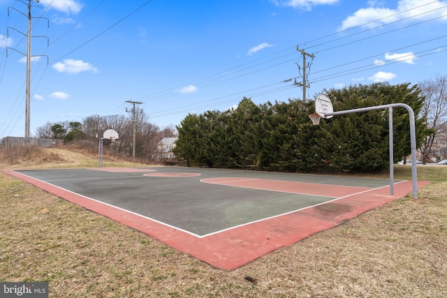 view of sport court with community basketball court and a lawn