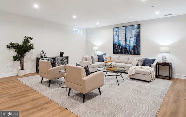 living room with light hardwood / wood-style flooring