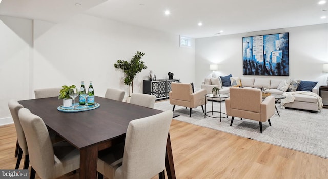 dining area with light hardwood / wood-style floors