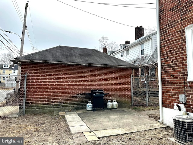 view of home's exterior featuring central AC unit and a patio