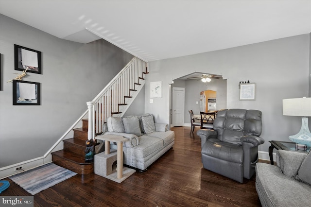 living room featuring hardwood / wood-style flooring and ceiling fan