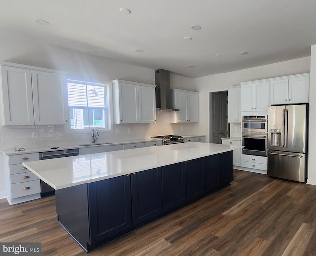00 Sadie, Arnold, MD 21012 - kitchen featuring appliances with stainless steel finishes, wall chimney range hood, a sink, a spacious island, and light countertops