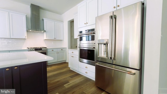 00 Sadie, Arnold, MD 21012 - kitchen with high quality appliances, wall chimney range hood, dark wood finished floors, light countertops, and backsplash