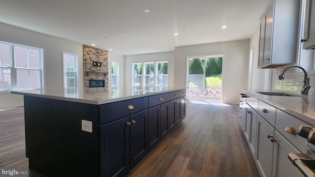 00 Sadie, Arnold, MD 21012 - kitchen with a sink, dark wood-type flooring, recessed lighting, backsplash, and light countertops