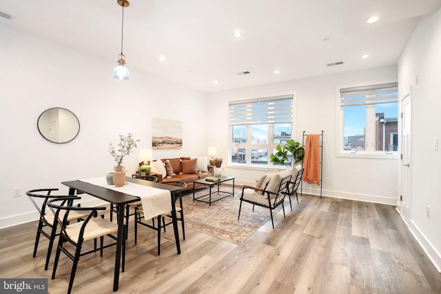 dining area with light hardwood / wood-style floors